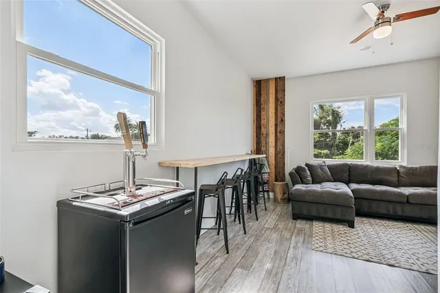 a view of a patio with couches chairs and a yard
