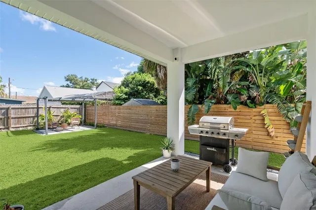 a view of a garden with a bench in the background