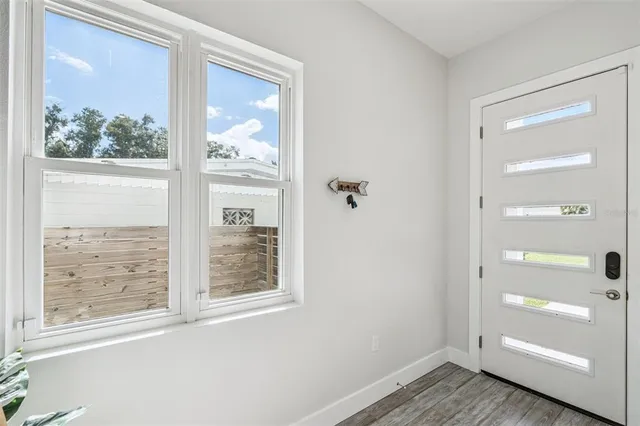 a living room with furniture fireplace and window