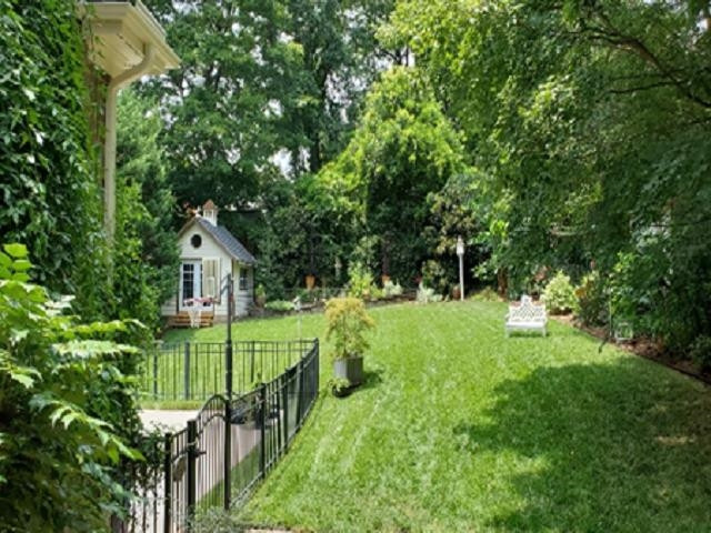 2113 Cowper Drive Raleigh, NC 27608 - Photo 47 of 48 ...shows years of special attention to detail. Summer view of the lovingly landscaped back yard