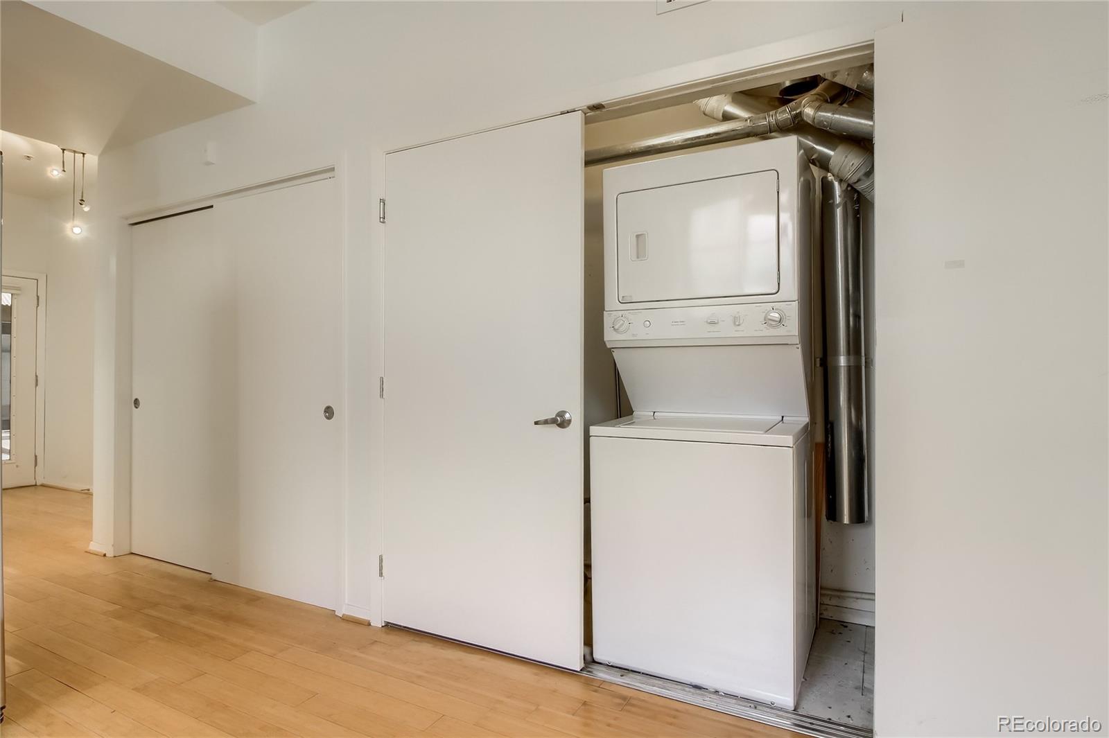 3225 Blake Street, Unit 2 Denver, CO 80205 - Photo 17 of 31 a view of walk in closet with empty racks