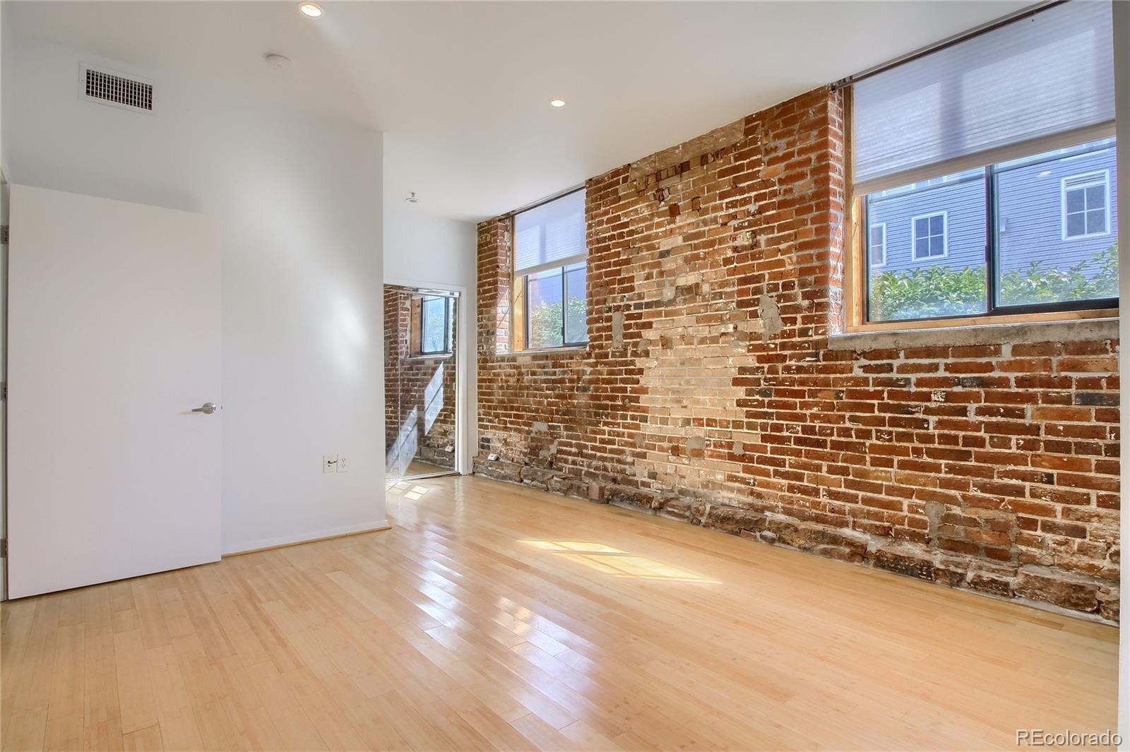 3225 Blake Street, Unit 2 Denver, CO 80205 - Photo 20 of 31 a view of an empty room with a window