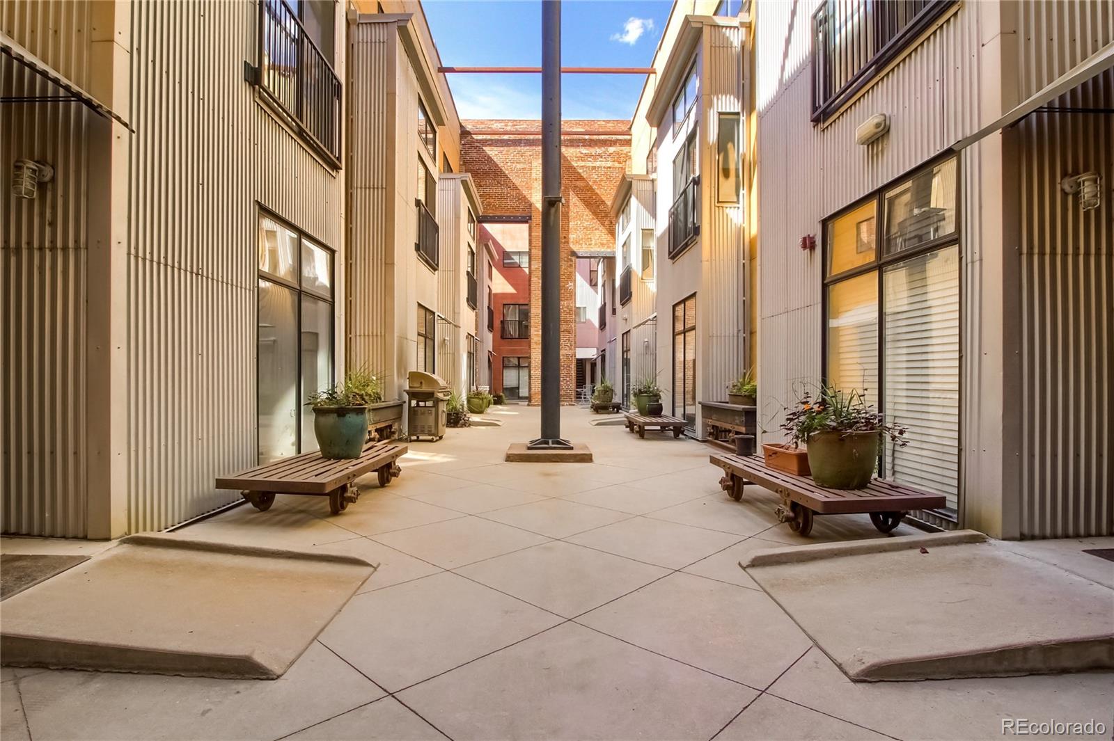 3225 Blake Street, Unit 2 Denver, CO 80205 - Photo 31 of 31 a view of a patio with a table and chairs