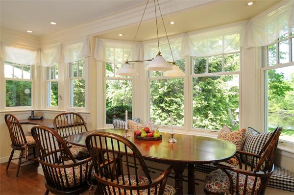 113 Cliff Road Wellesley, MA 02481 - Photo 11 of 25 a view of a dining room with furniture window and outside view