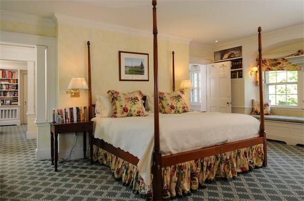 113 Cliff Road Wellesley, MA 02481 - Photo 14 of 25 a bedroom with a bed and a table in it