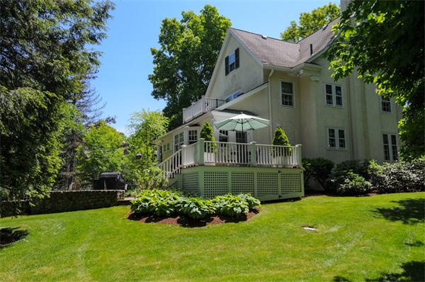 113 Cliff Road Wellesley, MA 02481 - Photo 22 of 25 a front view of a house with a yard