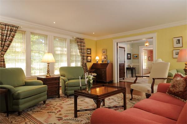 113 Cliff Road Wellesley, MA 02481 - Photo 5 of 25 a living room with furniture a table and a large window