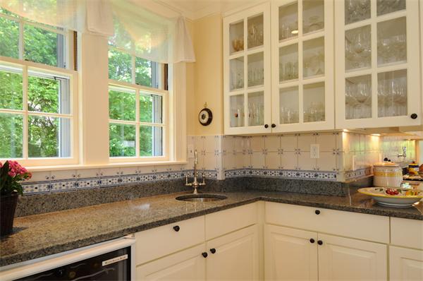 113 Cliff Road Wellesley, MA 02481 - Photo 8 of 25 a kitchen with granite countertop a sink and a window