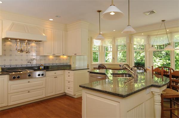 113 Cliff Road Wellesley, MA 02481 - Photo 9 of 25 a kitchen with granite countertop a sink a counter space appliances and cabinets