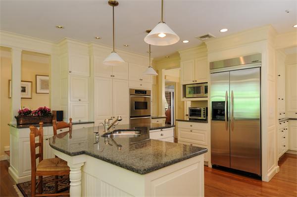 113 Cliff Road Wellesley, MA 02481 - Photo 10 of 25 a kitchen with stainless steel appliances granite countertop a sink and a refrigerator