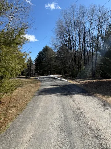 a view of road with trees