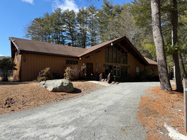 a view of a two house with a yard covered in snow