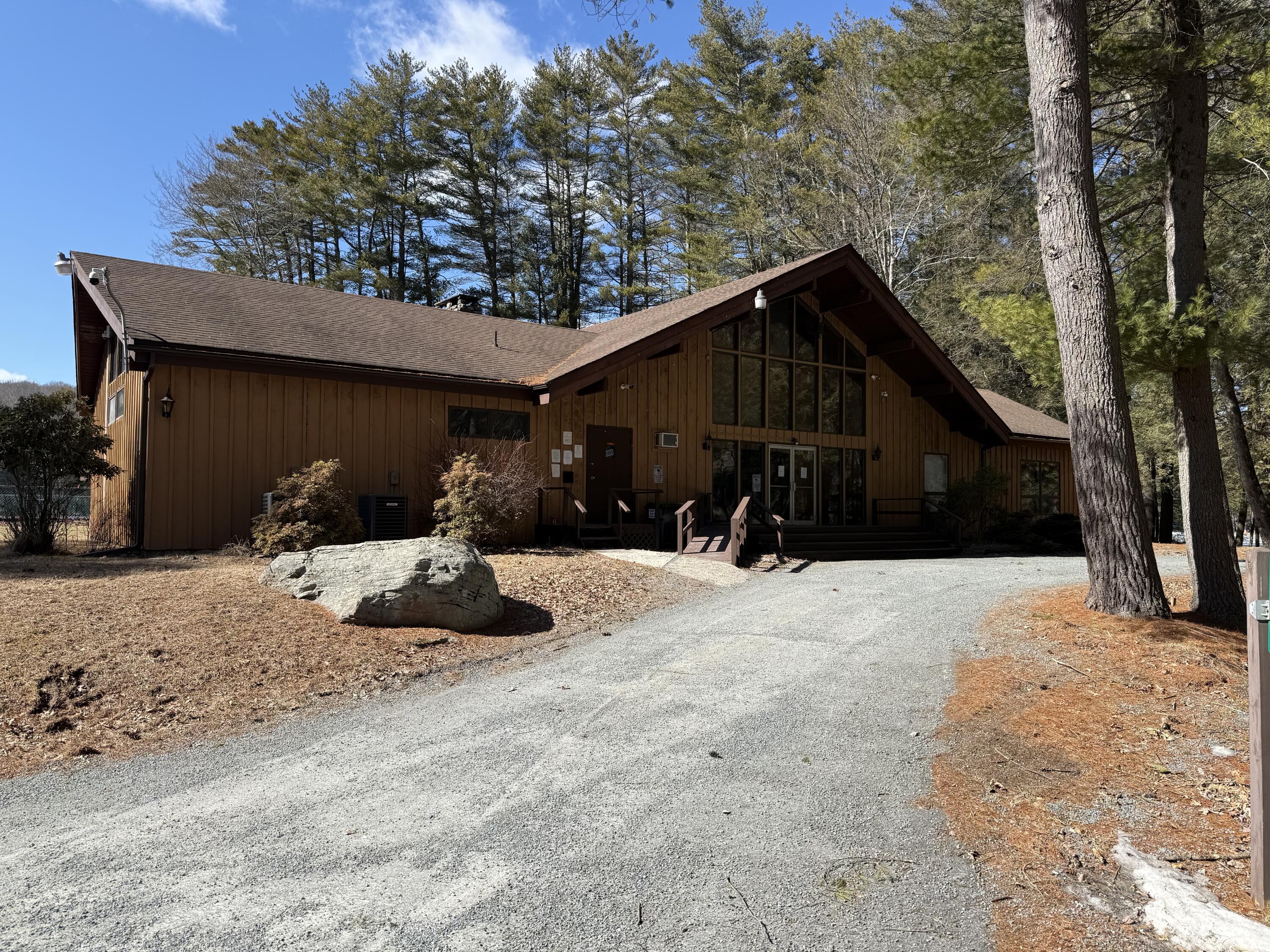 Woodledge Village Woodledge Village Meadow Hawley, PA 18428 - Photo 2 of 22 a view of a two house with a yard covered in snow
