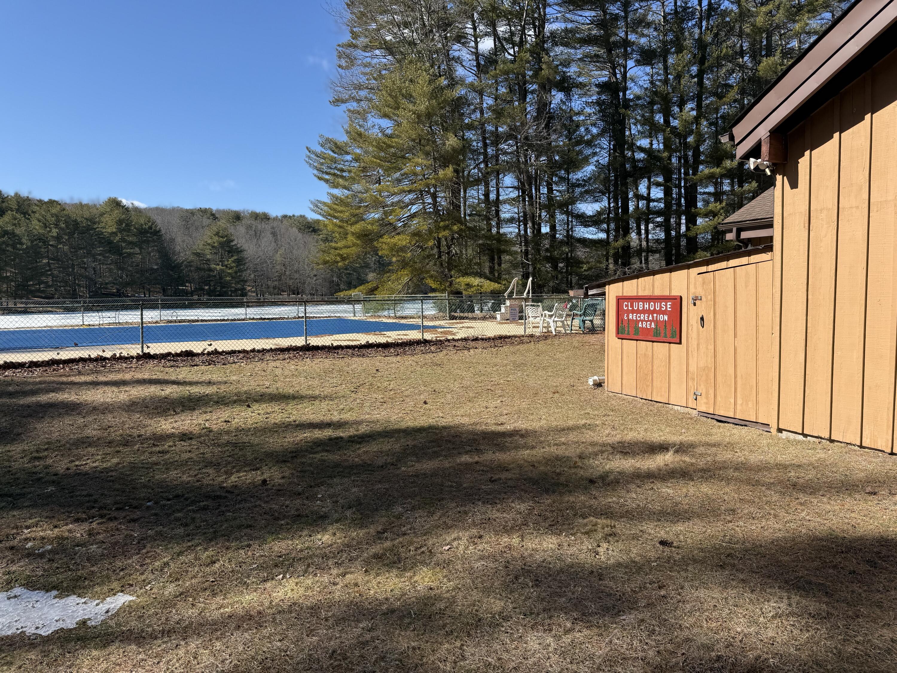 Woodledge Village Woodledge Village Meadow Hawley, PA 18428 - Photo 4 of 22 a view of swimming pool with trees in the background