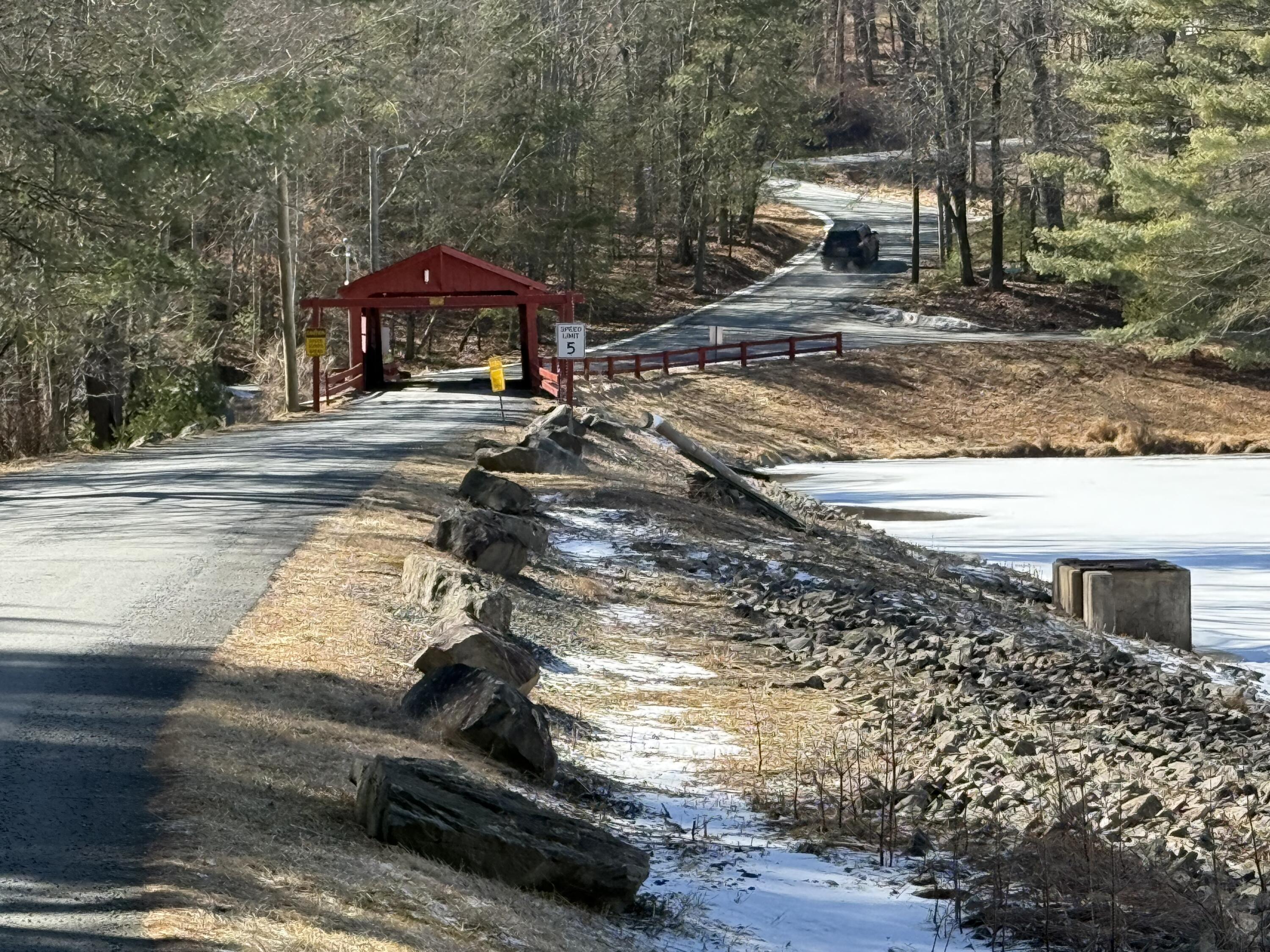 Woodledge Village Woodledge Village Meadow Hawley, PA 18428 - Photo 7 of 22 a sign board on the side of a street