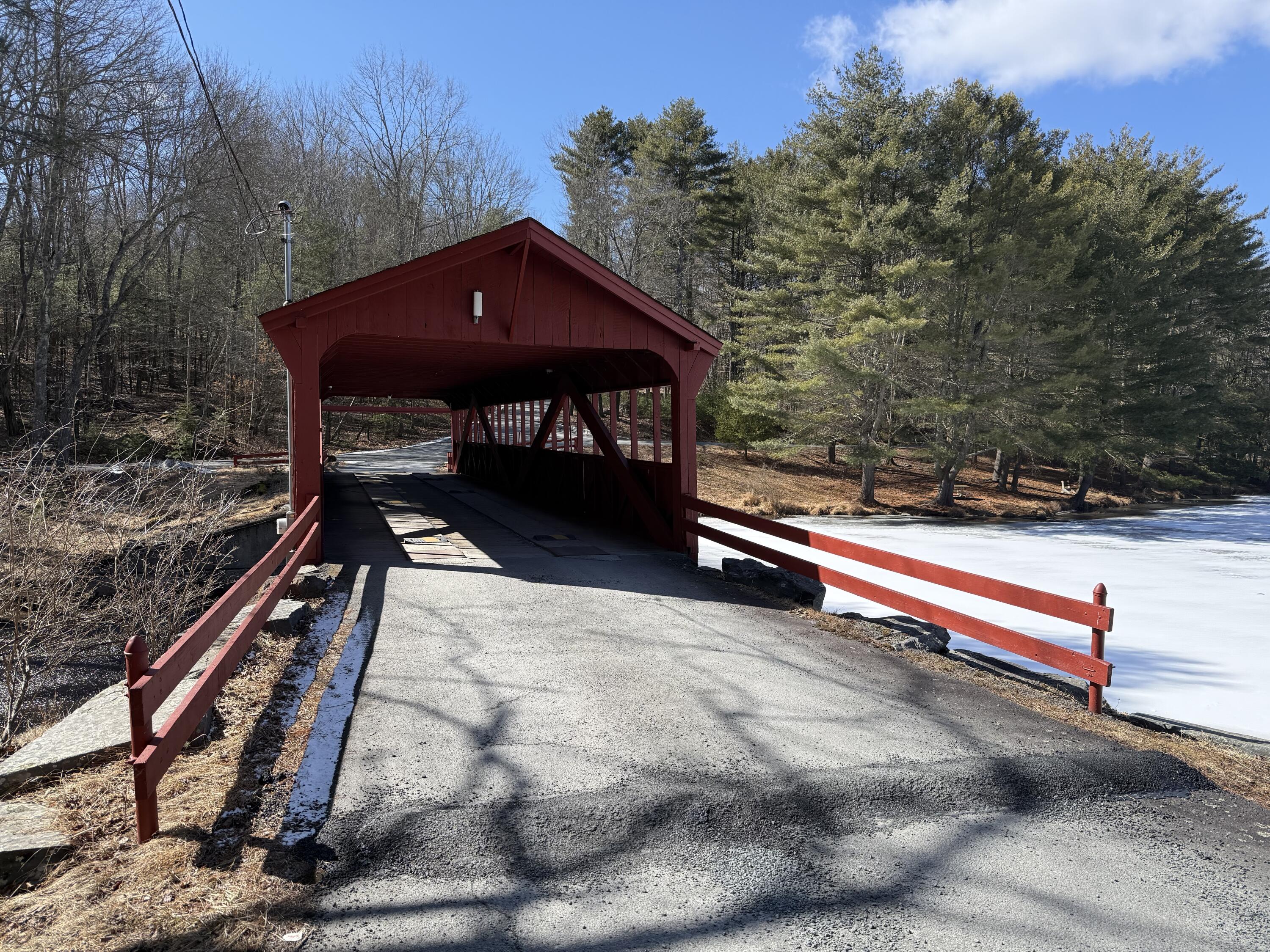 Woodledge Village Woodledge Village Meadow Hawley, PA 18428 - Photo 10 of 22 a backyard of a house with table and chairs