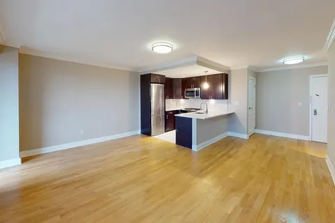 a view of kitchen with wooden floor