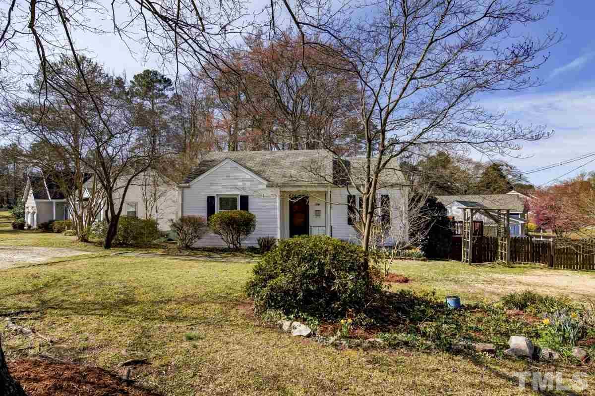 1719 Bennett Street Raleigh, NC 27604 - Photo 1 of 18 a front view of a house with a yard