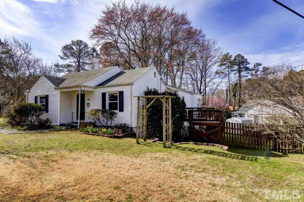 1719 Bennett Street Raleigh, NC 27604 - Photo 2 of 18 a front view of house with yard outdoor seating and barbeque oven