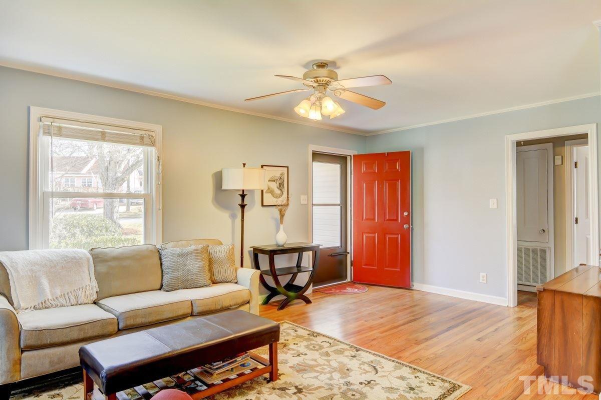 1719 Bennett Street Raleigh, NC 27604 - Photo 3 of 18 a living room with furniture a dining table and a window