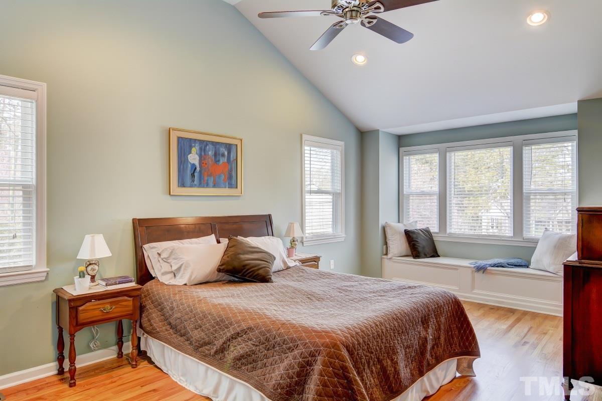 1719 Bennett Street Raleigh, NC 27604 - Photo 9 of 18 a bedroom with a large bed and a balcony