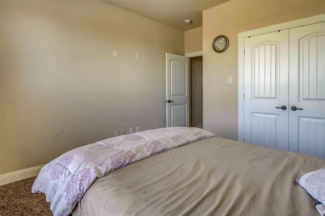 a bedroom with a bed and a shower