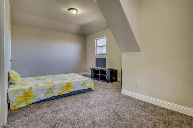 a bedroom with a bed and a cabinets