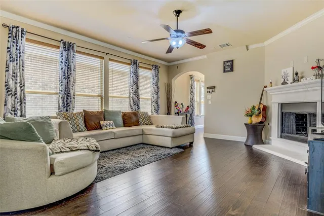 a living room with furniture and a fireplace