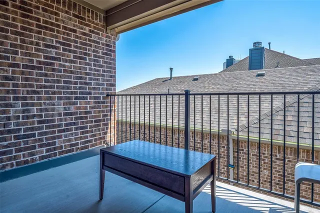 a view of a balcony with a wooden floor