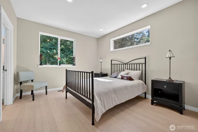 a bed room with a bed and a chair