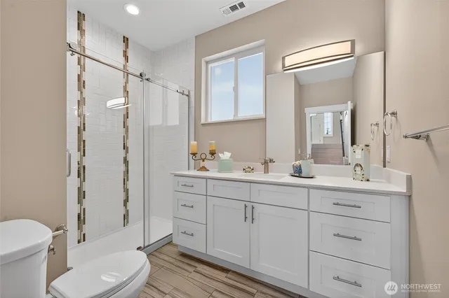 a bedroom with a bed and a night stand