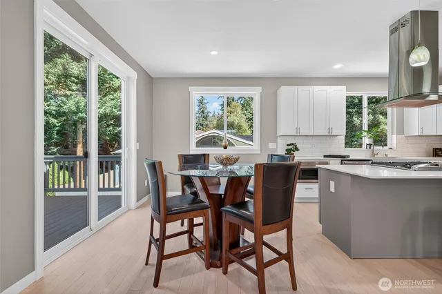 a view of a dining room with furniture window and outside view