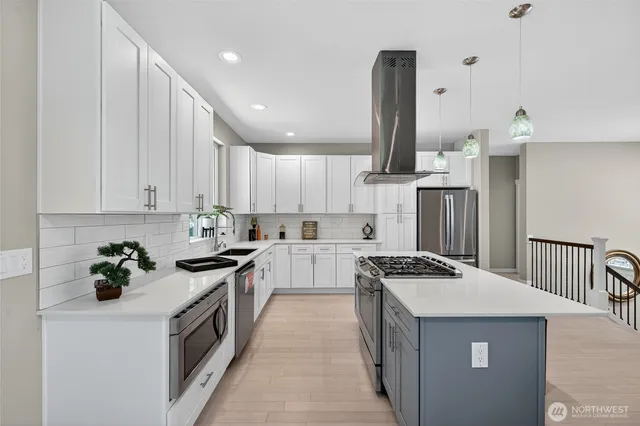 a kitchen with a stove a sink and a refrigerator