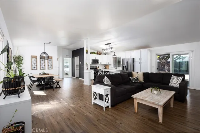 a bedroom with a bed lamp and potted plant