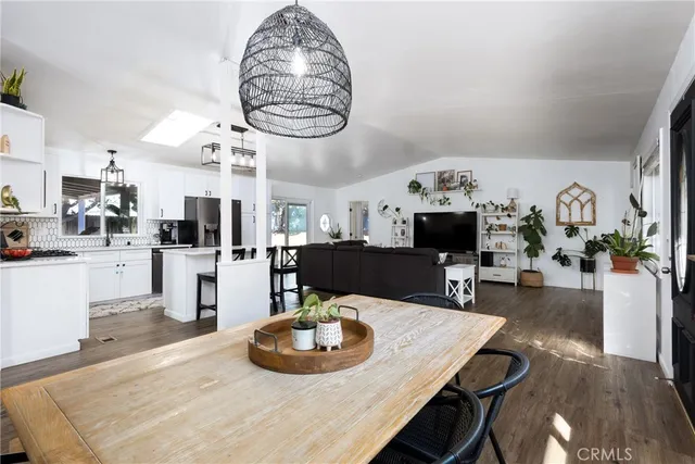 a outdoor space with lots of tables and a potted plant