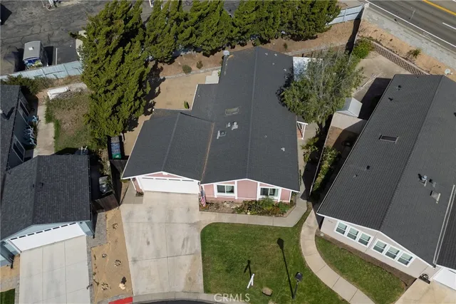 an aerial view of a house with a swimming pool