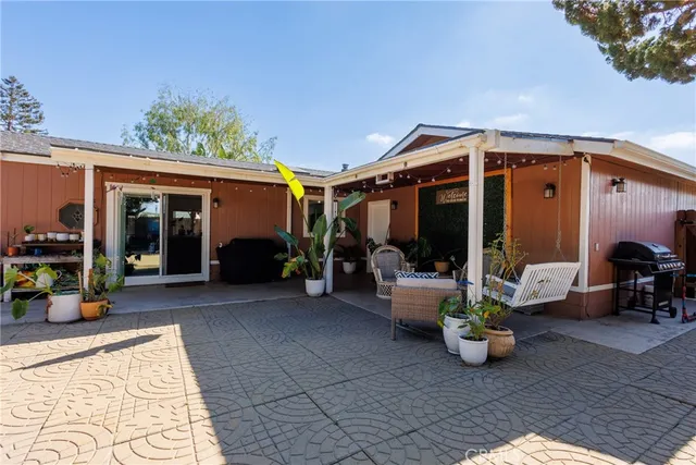 a view of a swimming pool with an outdoor seating