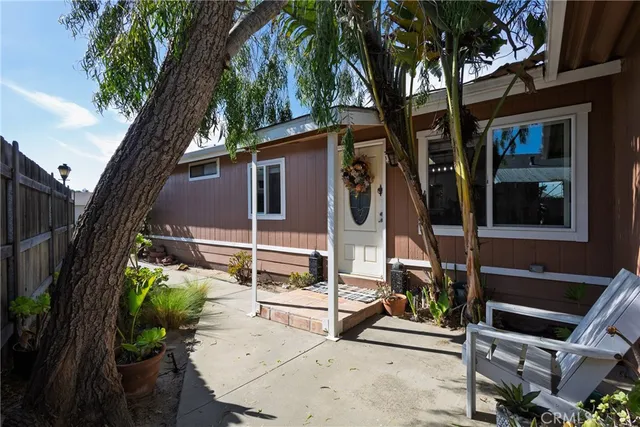 an aerial view of a house with outdoor space and a lake view