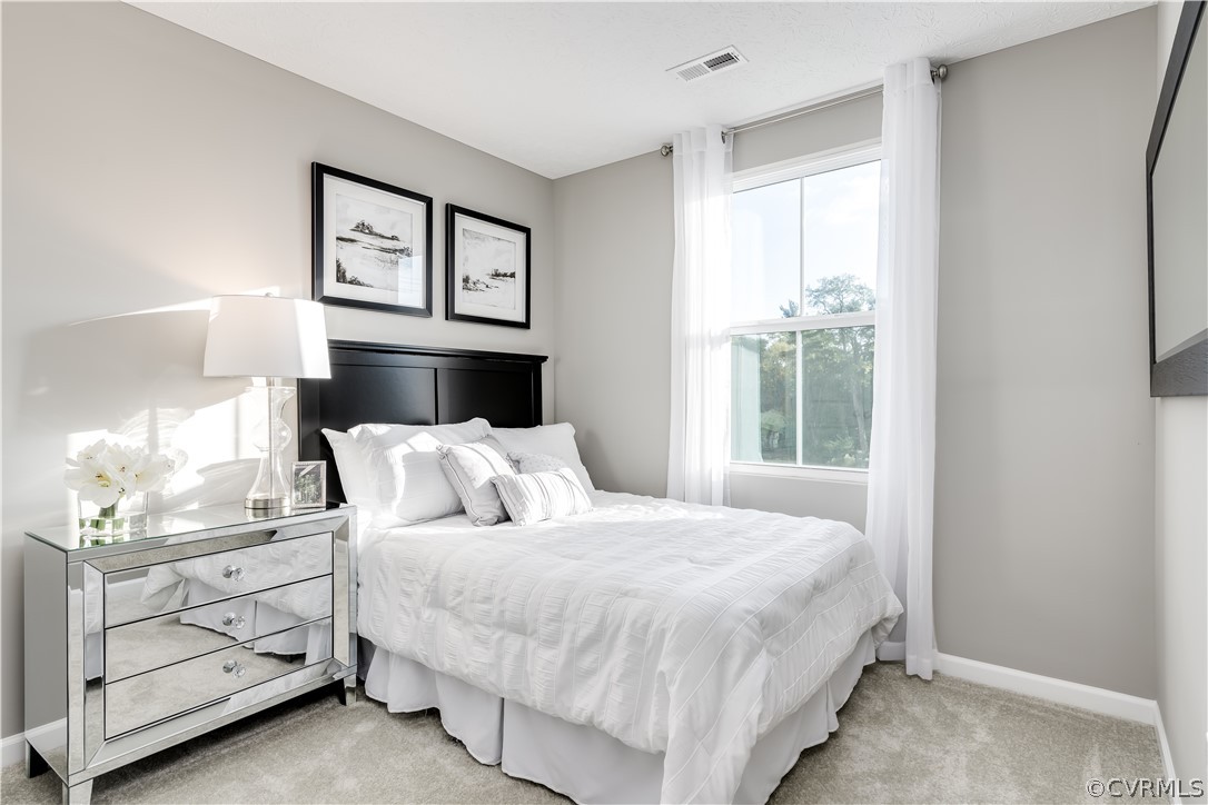 1140 Canterbury Ridge Road Richmond, VA 23224 - Photo 11 of 13 a bedroom with a bed and a window
