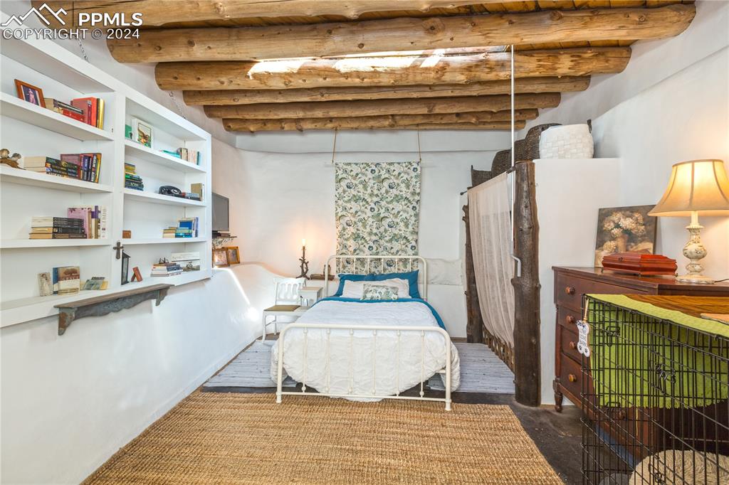 654 Tess Trace Road Guffey, CO 80820 - Photo 14 of 42 a picture of a living room with a rug and a fireplace