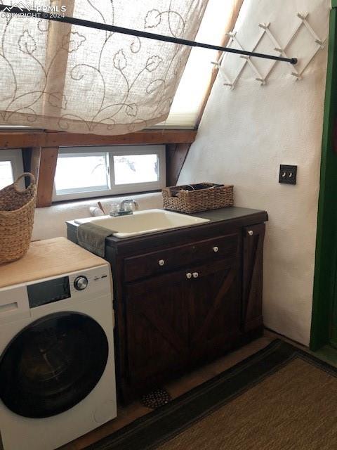 654 Tess Trace Road Guffey, CO 80820 - Photo 19 of 42 a utility room with dryer and washer