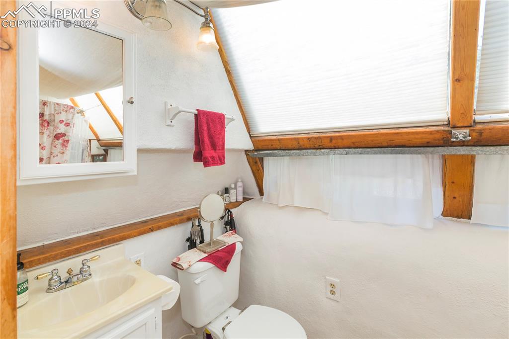 654 Tess Trace Road Guffey, CO 80820 - Photo 23 of 42 a bathroom with a sink and a mirror