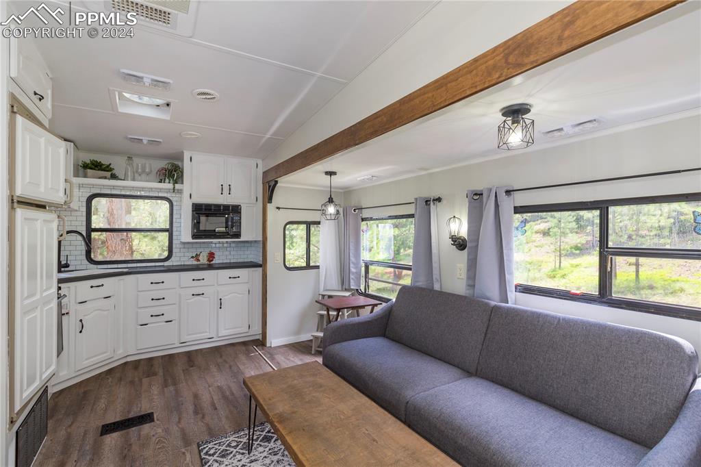 654 Tess Trace Road Guffey, CO 80820 - Photo 33 of 42 a living room with furniture and windows
