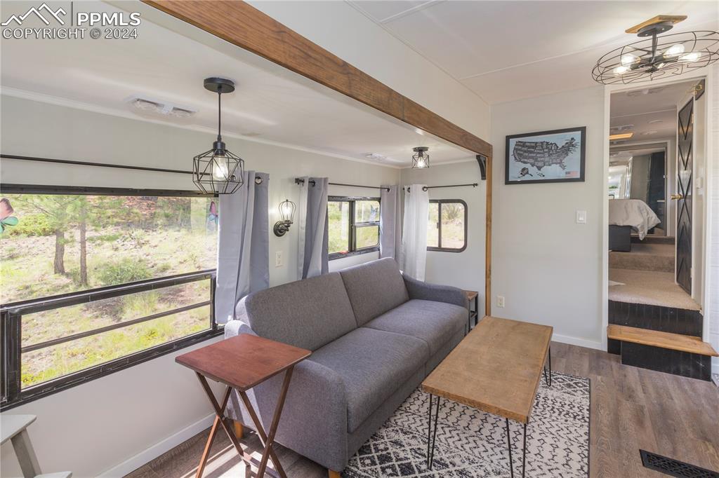 654 Tess Trace Road Guffey, CO 80820 - Photo 34 of 42 a living room with furniture and a large window