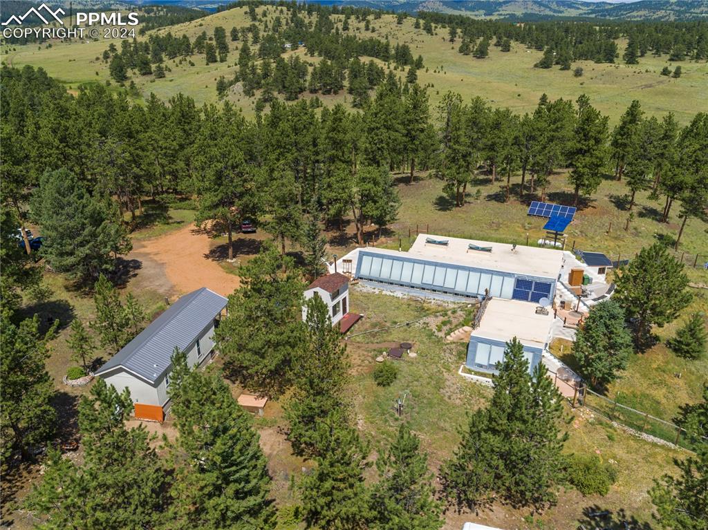 654 Tess Trace Road Guffey, CO 80820 - Photo 39 of 42 an aerial view of house with yard and ocean view