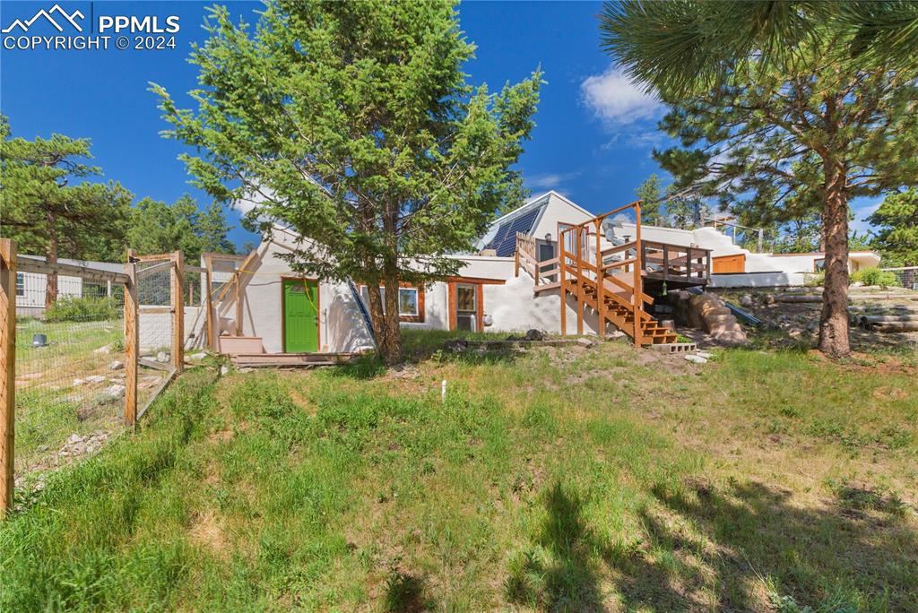 654 Tess Trace Road Guffey, CO 80820 - Photo 41 of 42 a view of a house with a yard