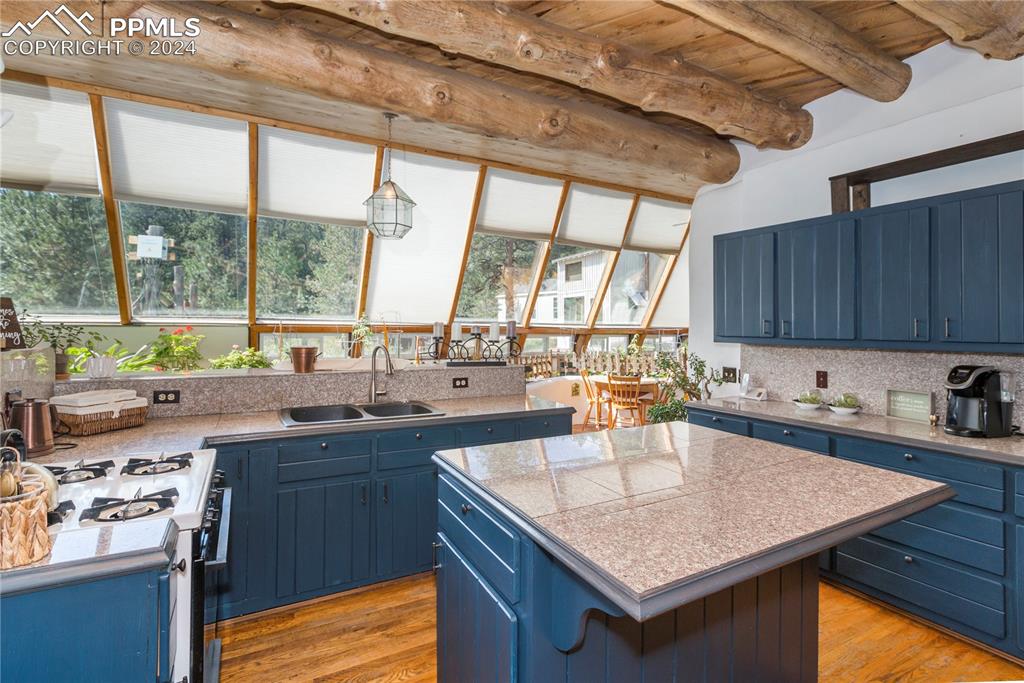 654 Tess Trace Road Guffey, CO 80820 - Photo 6 of 42 a kitchen with a sink a counter top space and appliances