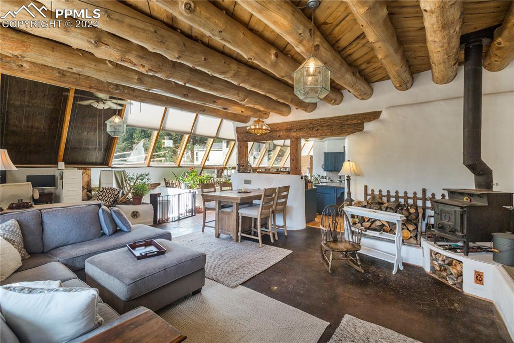 654 Tess Trace Road Guffey, CO 80820 - Photo 9 of 42 a living room with furniture and a flat screen tv