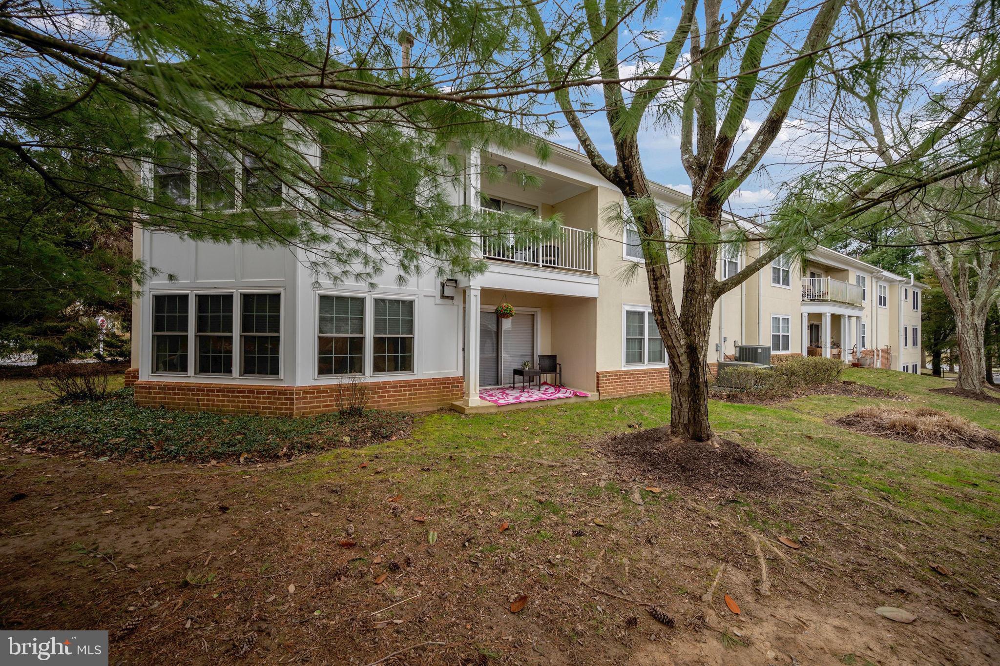 9136 Ruth Elder Lane, Unit 9136 Pikesville, MD 21208 - Photo 11 of 11 a view of a house with a tree in the yard