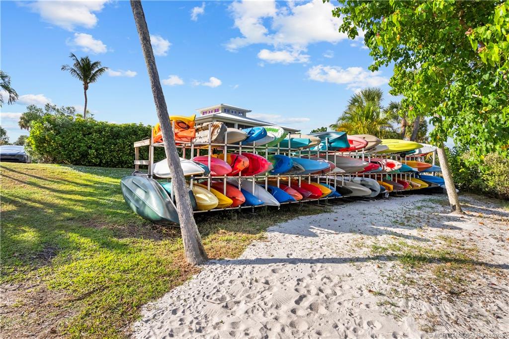5313 Southeast Miles Grant Road, Unit K209 Stuart, FL 34997 - Photo 22 of 34 a childrens park with lots of swings and slides